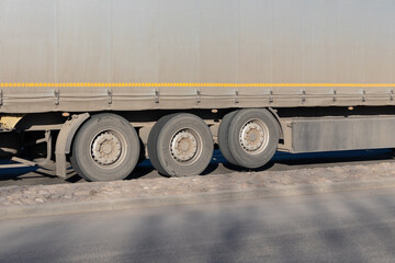 Naklejka na ściany i meble 1 axle raised for 3-axle semi-trailer. Truck tires