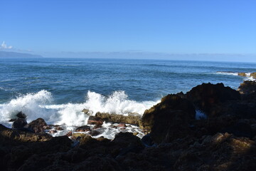 waves breaking on rocks
