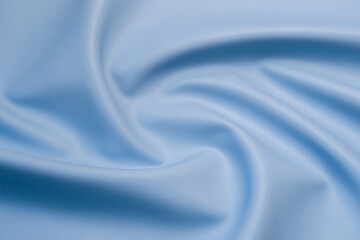 blue artificial leather with waves and folds on PVC base