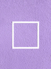 Facade of coarse fraction with grain texture painted in purple color with white frame. Minimal concept. Copy space.