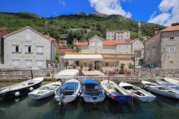 Fototapeta na wymiar Boats moored in the harbor in Perast town