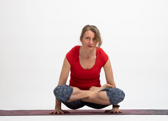 woman doing yoga on a white background Lolasana