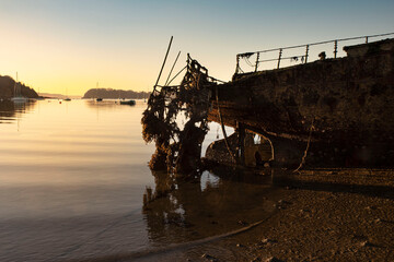 wreck of an old boat on a beach in Brittany, France