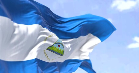 Detail of the national flag of Nicaragua waving in the wind on a clear day