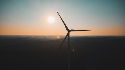 Fototapeta na wymiar View of the wind turbine in sunset. Countryside landscape. An aerial view drone photo