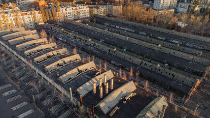Old factory, abandoned greenhouses in the middle of the city top view. Industrial drone photo