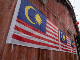 Malaysia flag is hang on wall.