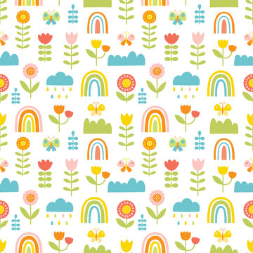 Seamless pattern with butterflies, flowers, clouds and rainbow. Vector illustration in hand drawn cartoon style.