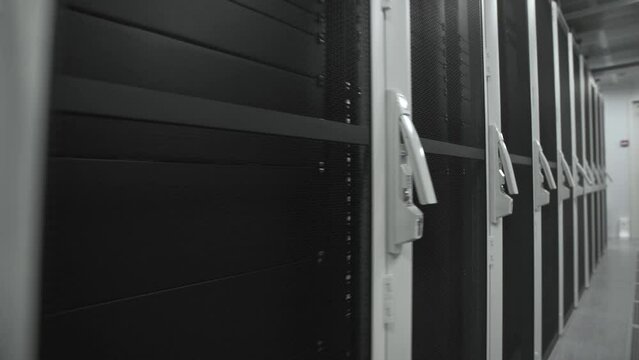 Symmetrically telecommunication racks in a sealed corridor. IT industry, technology concept.