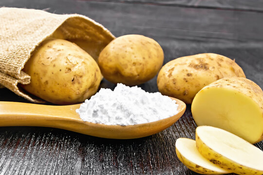Starch potato in spoon on black board