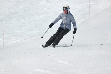 Fototapeta na wymiar Skiing in the winter snowy slopes