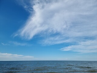 Naklejka na ściany i meble Blue sea waters and blue sky horizon