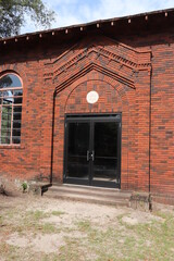 Fototapeta premium Red Brick Building in Graveyard