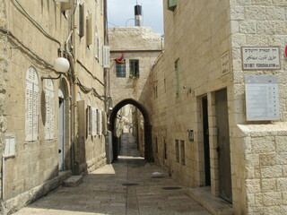 Cobblestone pathway and ancient archway in the old city of Jerusalem, Israel