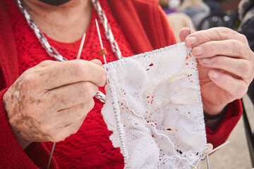 old woman's hands knitting