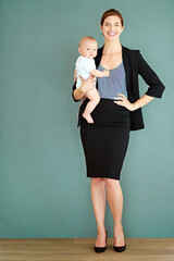 Im a proud working mom of a beautiful baby boy. Studio shot of a successful young businesswoman...