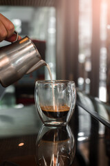 cup of coffee on black table in cafe