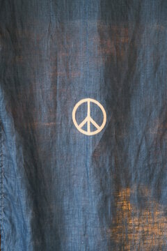 peace symbol printed on denim sheet