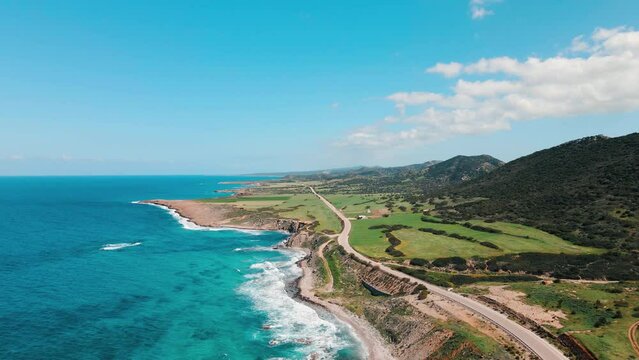 Aerial 4k rocky coastline with green nature in North Cyprus.
