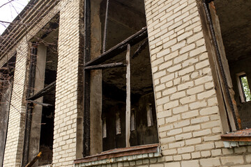 Fototapeta na wymiar Destroyed building. Burnt building . Broken windows with ash