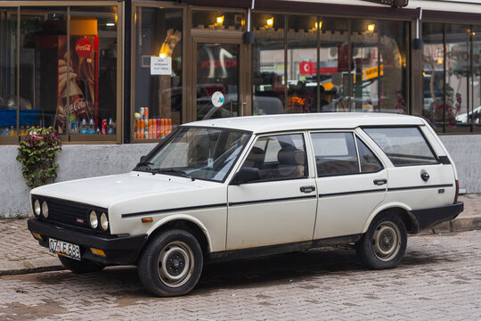 Side; Turkey – March 04 2022:  white Fiat 131  parked on the street on a warm  day