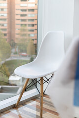 white chair on a window with a beautiful view