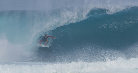 Obraz premium Surfer surfing big wave barrel tube pro surfer Tyler Newton