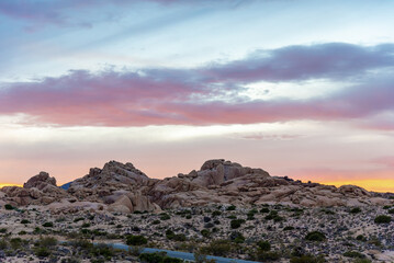 Fototapeta na wymiar Joshua Tree National Park at sunset with beautiful desert landscape over Mojave Desert. 