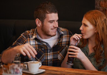 See I knew youd love this place. Cropped shot of a loving young couple on a coffee date.