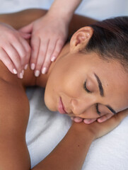 Obraz na płótnie Canvas Joyful spa dreams. Shot of a beautiful young woman enjoying a back massage at a spa.