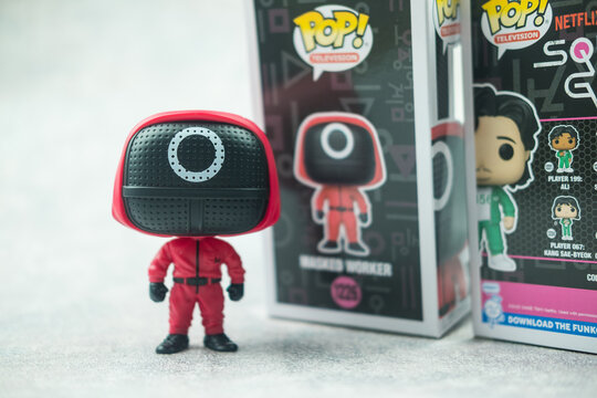 Samut Prakan, Thailand - March 22, 2022 : Cute Funko Pops form of a character from the series Squid Game on light background.