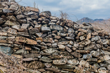 Old section of mountain fortress wall located in South Korea.