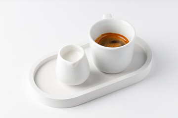 Cup with espresso or cappuccino on beton tray. Aroma, ristretto. Mug of coffee. White background. Modern