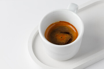One cup with espresso or cappuccino on beton tray. Aroma, ristretto. Mug of coffee. White background. Modern. Close up