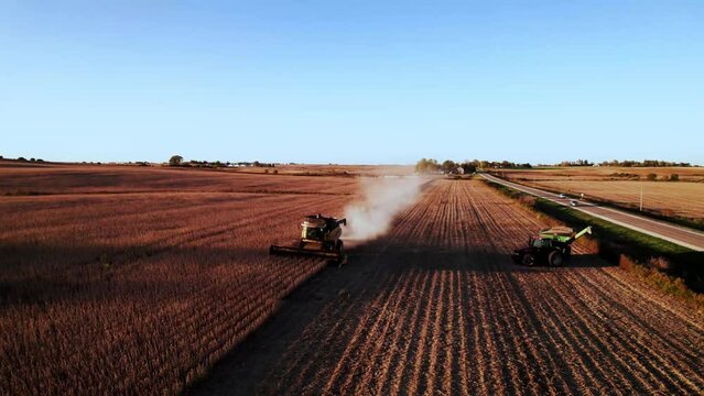 Soybean harvest in the midwest from a drone with a New Holland combine.