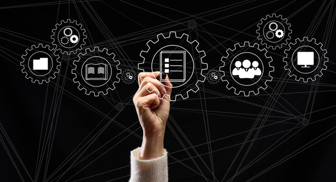 Control and management of business processes in the enterprise for efficient operation and increased profits. Concept with manager's hand and gears on holographic screen