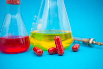 Medical, healthcare or Covid-19 still life with red capsules