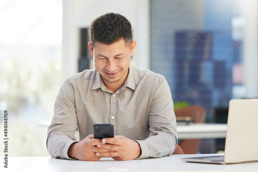Poster i need to check-in with a client. shot of a handsome young businessman sitting alone in his office a