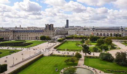 Beautiful panoramic view of the Tuileries gardens and the cityscape on a cloudy summer day. Paris,...
