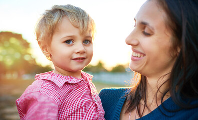 The sweet innocence of childhood. Portrait of a little boy bonding with his mother outdoors. © Koegelenberg/peopleimages.com
