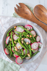 Spring salad plate with radish, cucumber, green pea