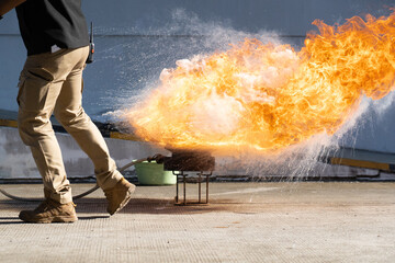 The instructor demonstrate and training the fire extinguisher use, fire evacuation and fire...