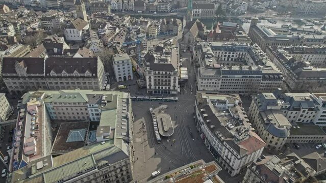 Aerial view of famous Parade Square (German Paradeplatz) with tram station and headquarters of famous Swiss Banks Credit Suisse and UBS. Movie shot March 21st, 2022, Zurich, Switzerland.