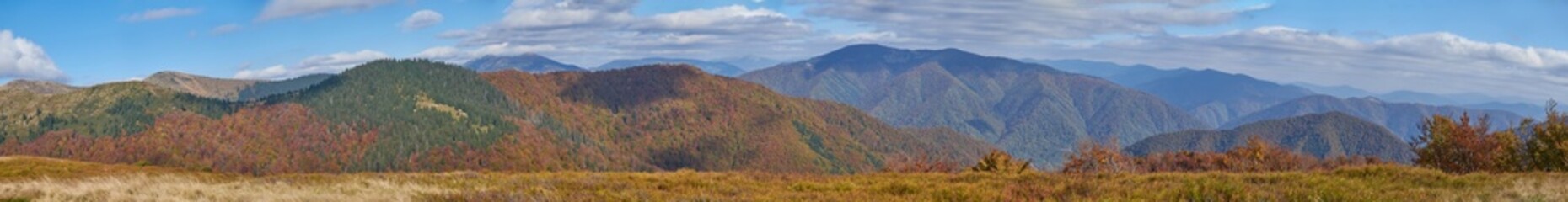 Panorama of autumn mountain landscape. Carpathian mountains in autumn