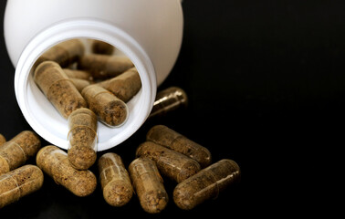 White bottle with probiotic capsules