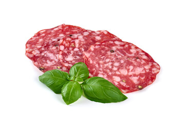Italian Salami with basil leaves, isolated on white background.