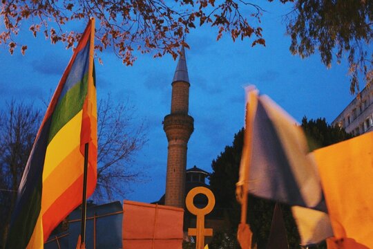 womens rights activism protest with minaret of mosque background