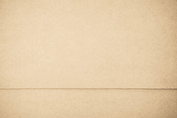 Brown recycled kraft cardboard background. Cream paper texture, Old vintage page grunge with vignette.