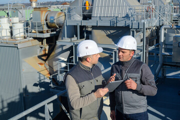 worker showing to supervisor security system setting up