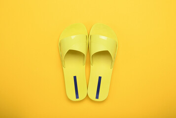 Yellow slippers on a yellow background. 